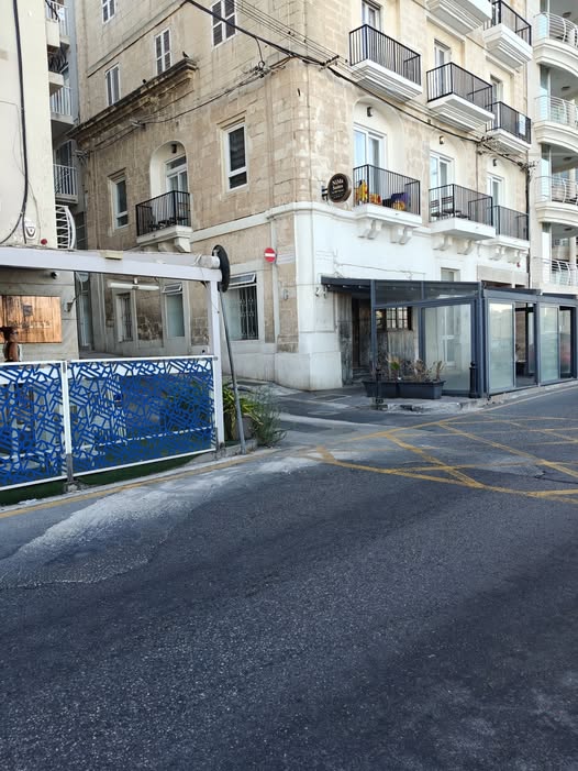 Outdoor catering furniture occupying space at a Sliema corner